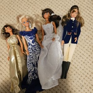 Barbie doll collection including 4 dolls and miscellaneous clothing